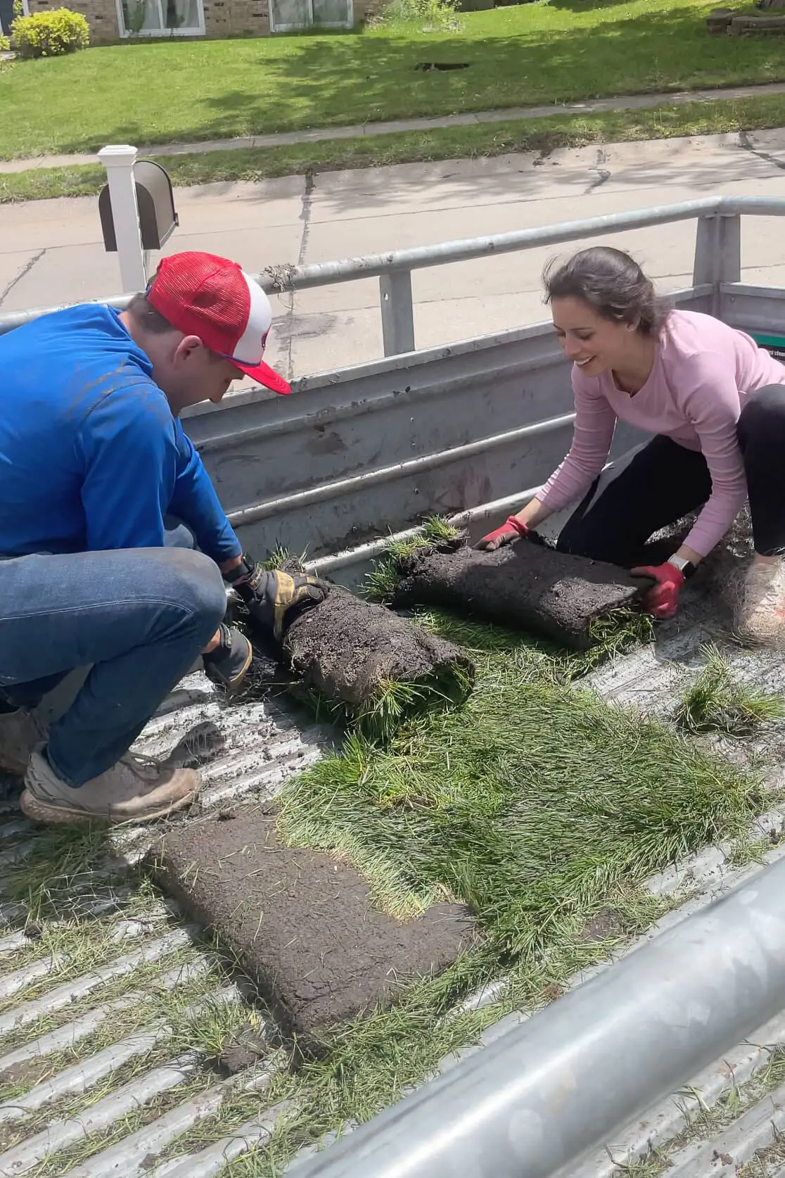 Unloading sod from a trailer.
